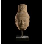 A KHMER SANDSTONE HEAD OF LOKESHVARAM BAYON STYLE, CIRCA 12TH-13TH CENTURY