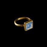 A ROMAN GOLD AND MOSAIC GLASS FINGER RING EGYPT, CIRCA 1ST CENTURY A.D.