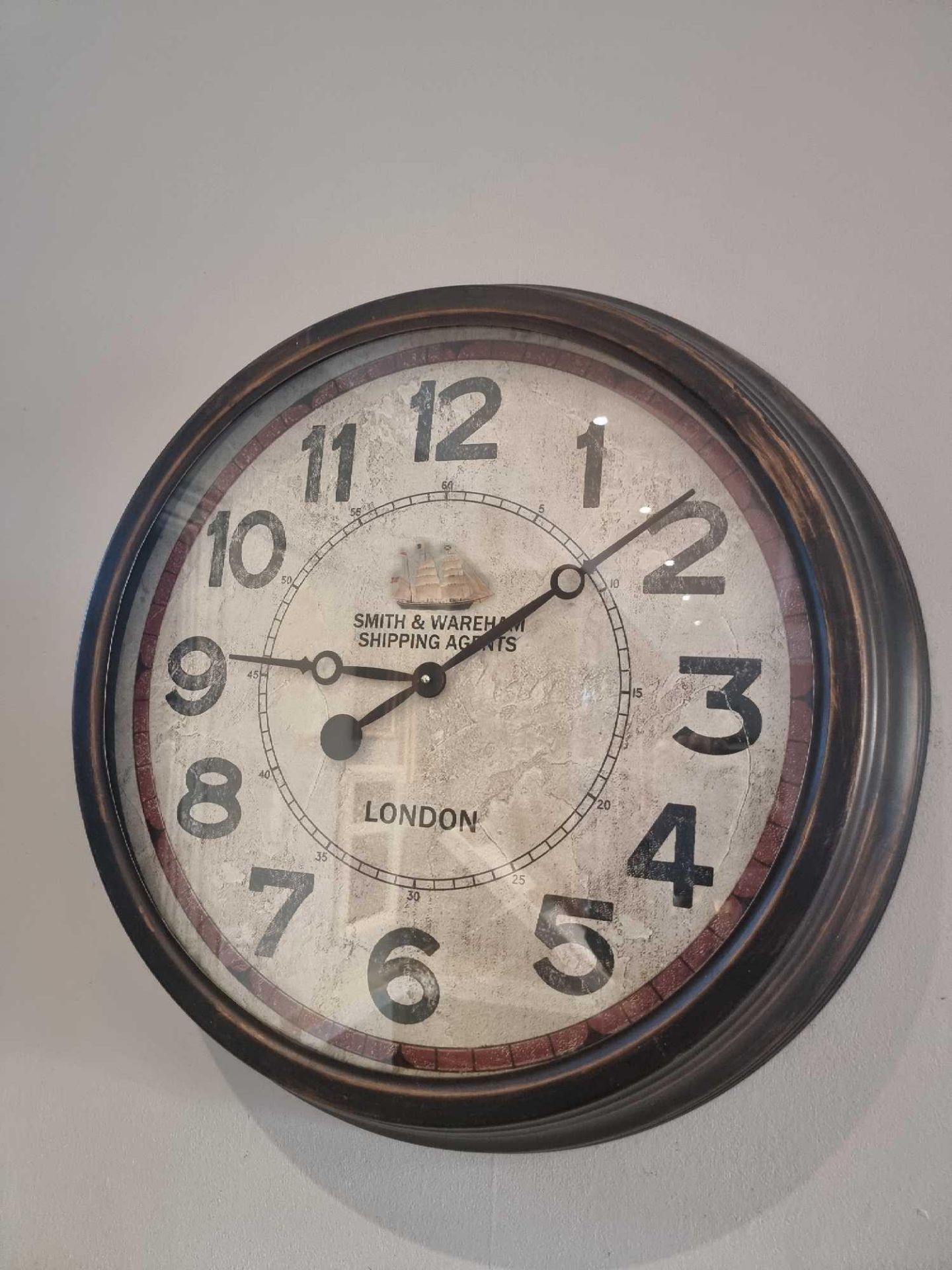 Wall mounted clock marked Smith and Wareham Shipping Agents London 60cm ( 1042 Bar )