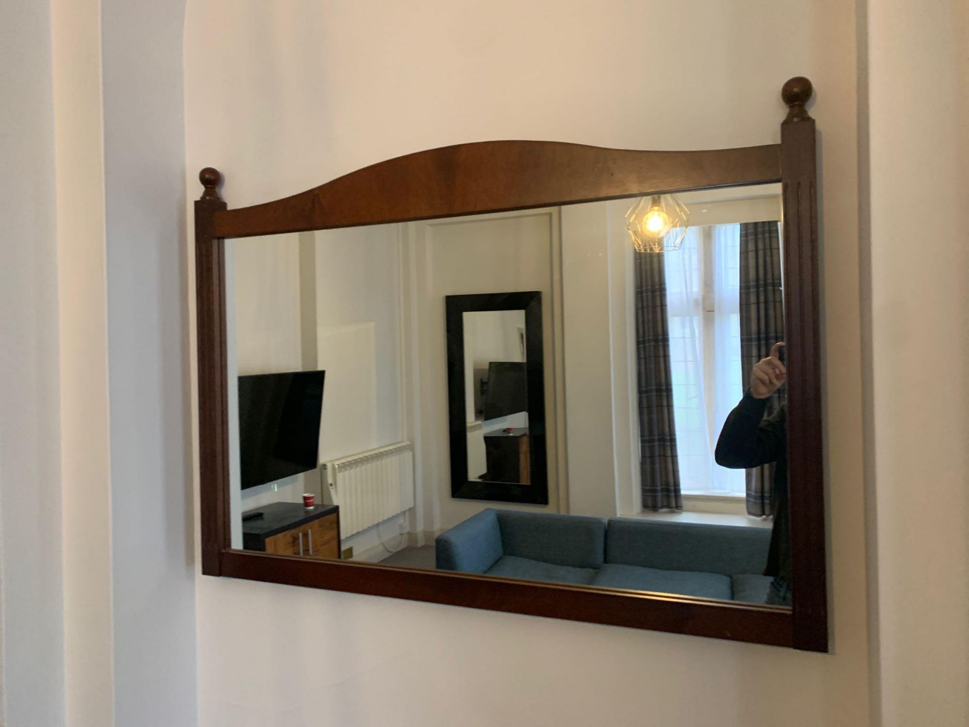 A mahogany stained dark brown wood frame mirror 110 cm wide Room LG20 ( East Wing )