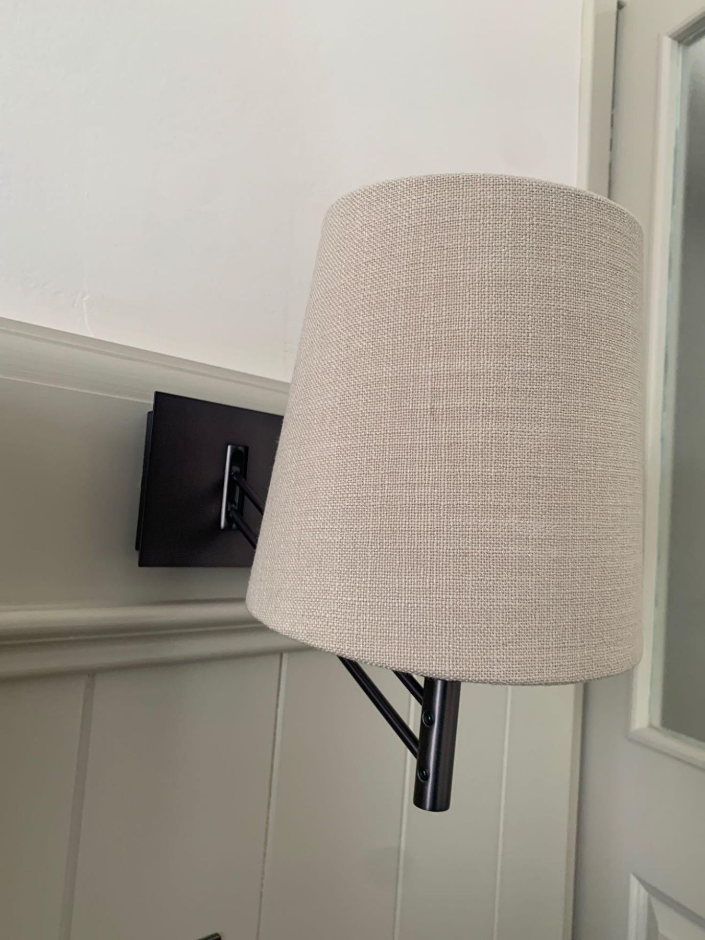 A pair of Chelsom Adjust Reading Wall Light black bronze with linen bone French drum shade model