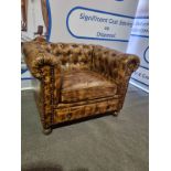 Chesterfield Armchair A smart, stylish and timelessly classic Chesterfield armchair upholstered in