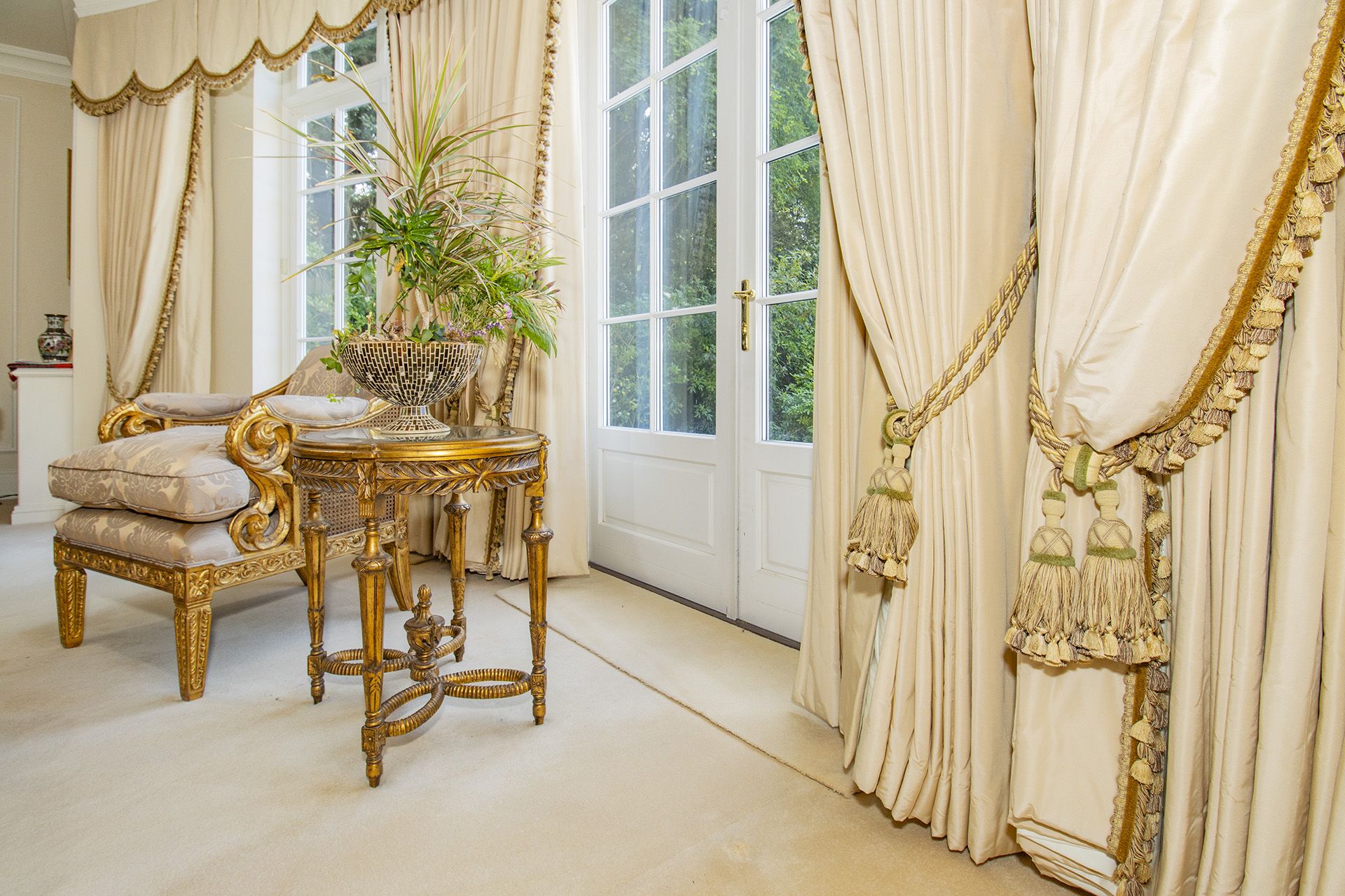 Silk cream drapes with pelmet and swags spans an area of 5m french door and windows