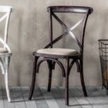 A Pair Of Cafe Chairs A Pack Of 2 Understated Cross Back Chairs In A Ditressed Black Finish With
