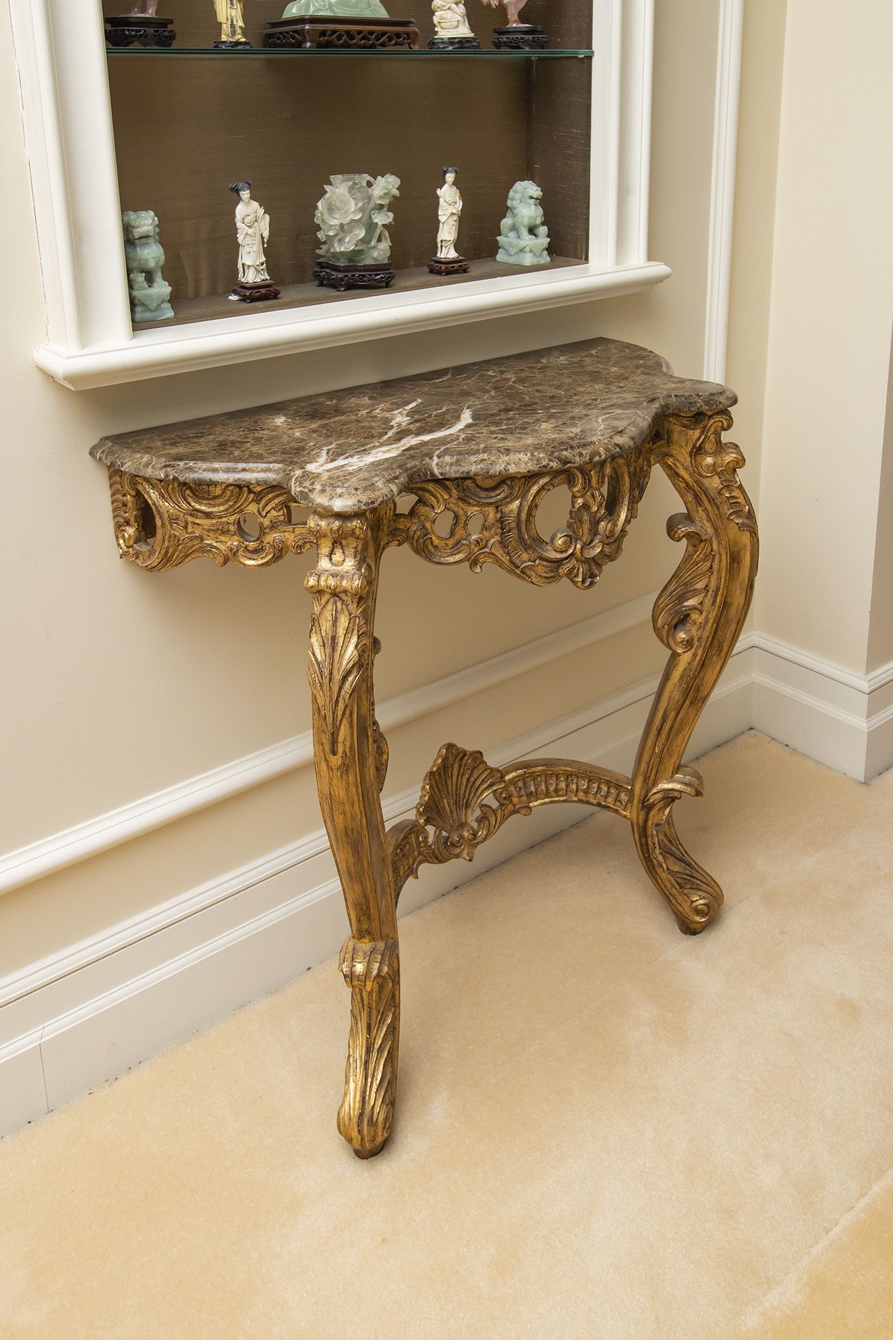 A pair of Christopher Guy wall mounted demi lune tables magnificently hand-carved legs in the volute