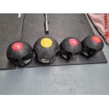 A set of Bodymax double handled medicine balls ranging from 3kg to 8kg set of 4