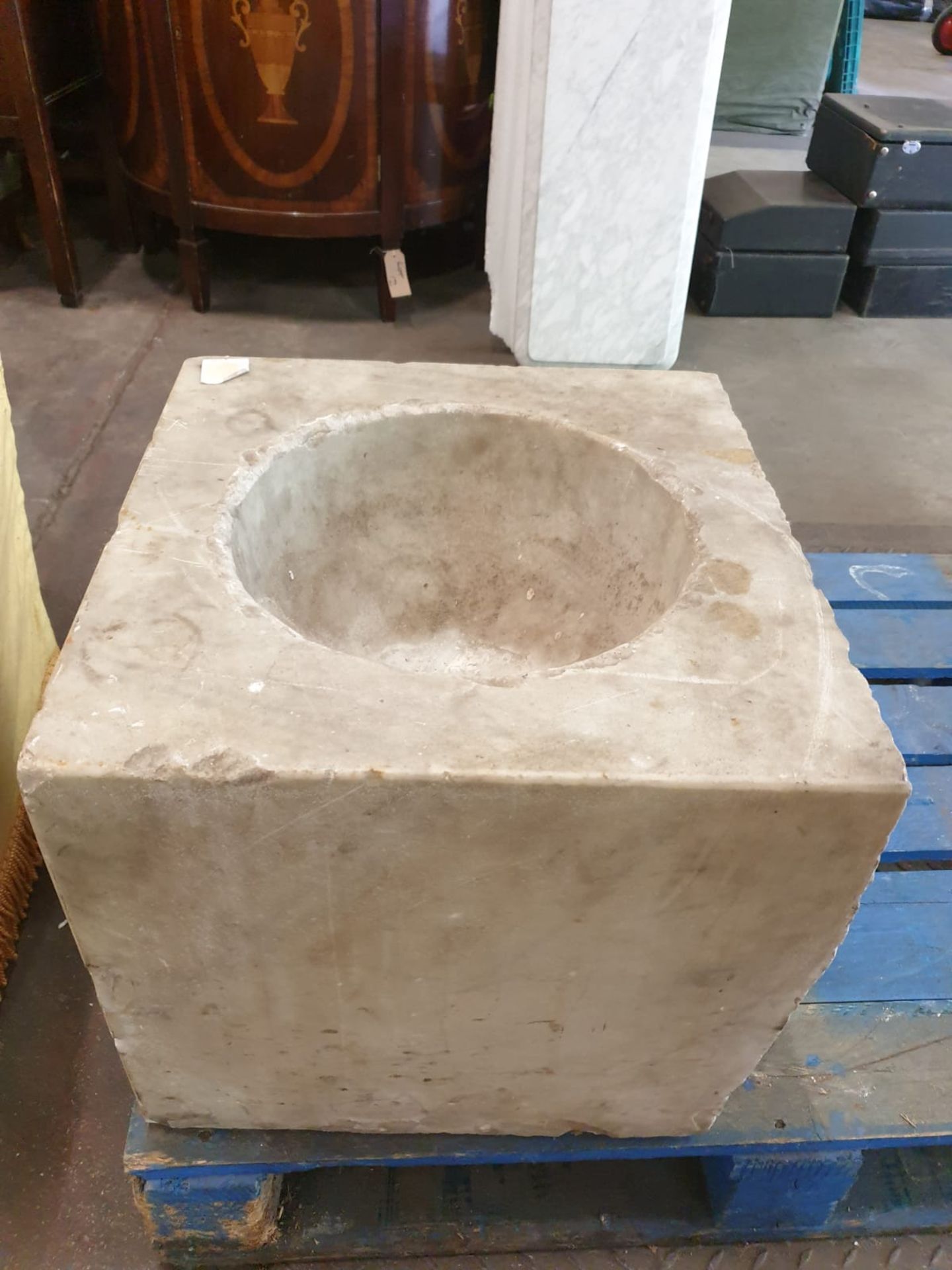 A marble square font with bowl scooped out 46 x 44 x 39cm