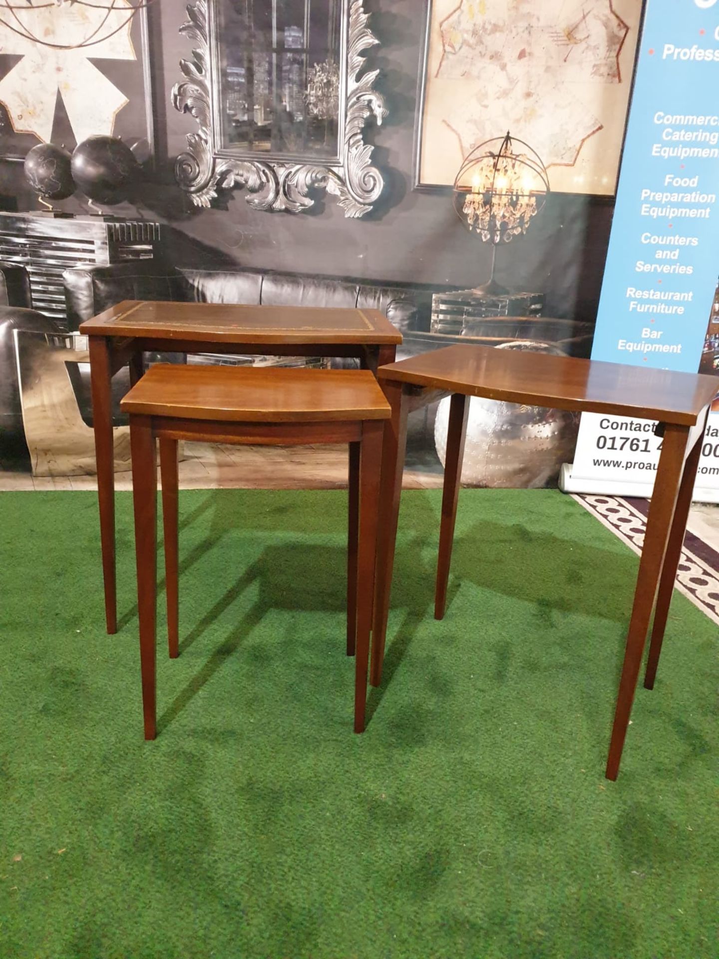 A nest of three mahogany bow front tables in the George III style. The largest table with a gilt - Image 3 of 5