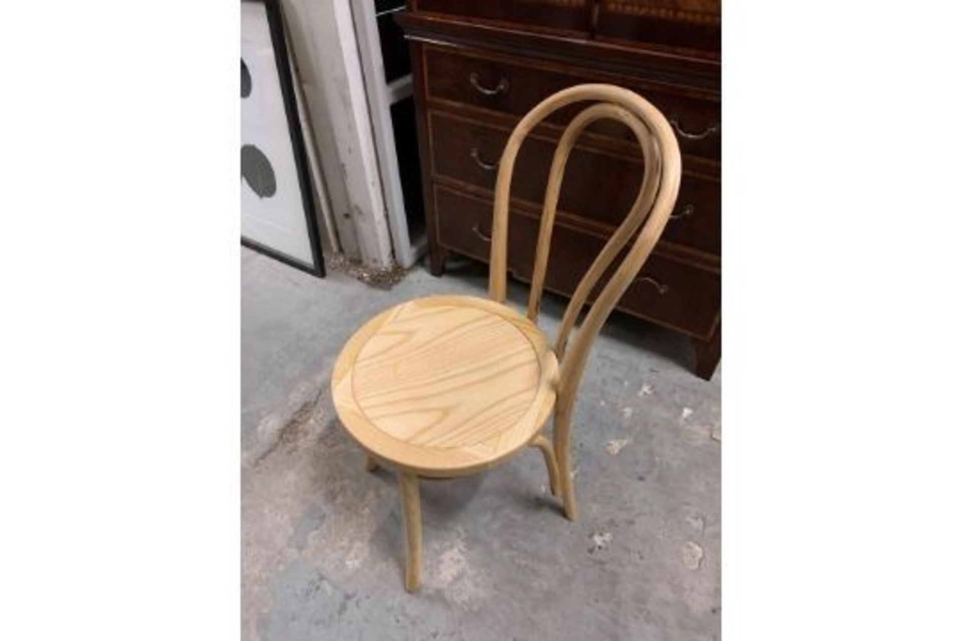 A pair of Foy natural chairs Foy Chairs Natural This Foy Natural Dining Chair Offers A Classic