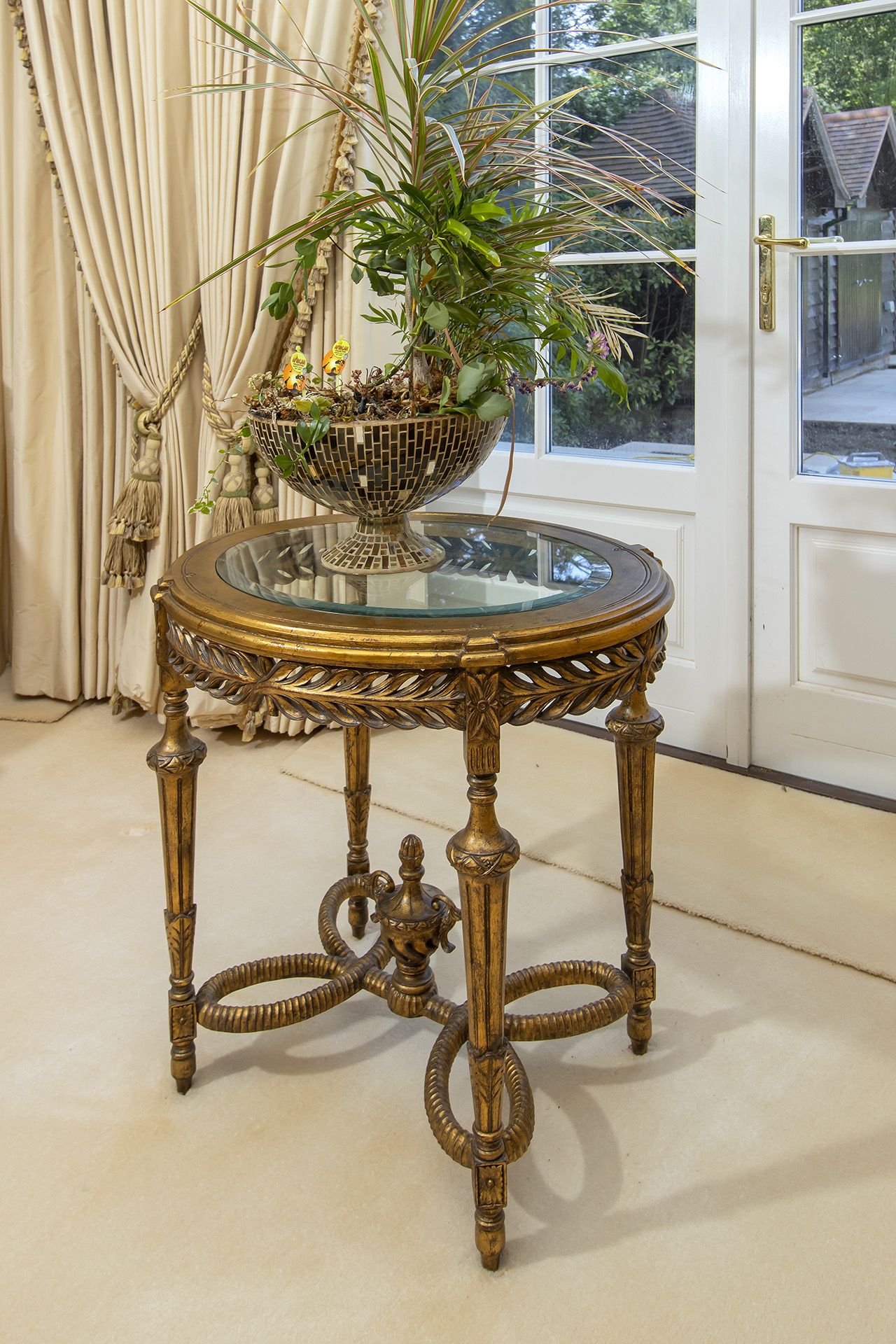 A Louis XVI style round accent mirror plate top side table with a pierced apron, above fluted - Image 2 of 2