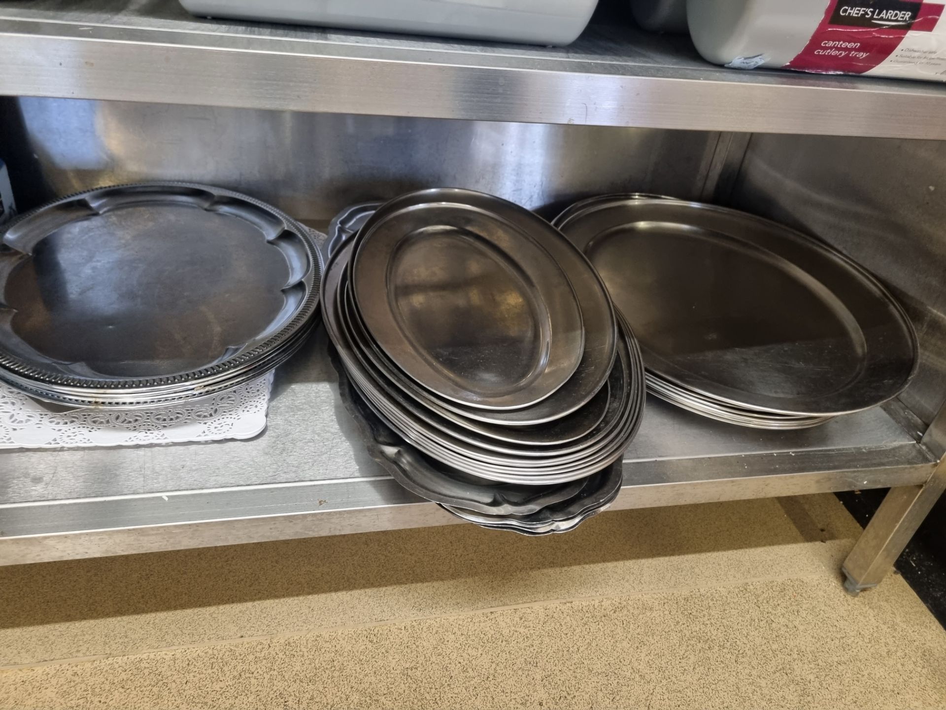 Various stainless steel platters as found