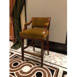 Neoclassic style mahogany tall bar stool, with a aged gold upholstered padded back and seat part