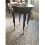 Circular Side Table With Antiqued Plate Top And Brass Trim Mounted On Tapering Legs With Brass