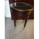 Circular Side Table With Antiqued Plate Top And Brass Trim Mounted On Tapering Legs With Brass