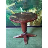 A mahogany circular pedestal dining table round top mounted on a heavy large turned baluster stem