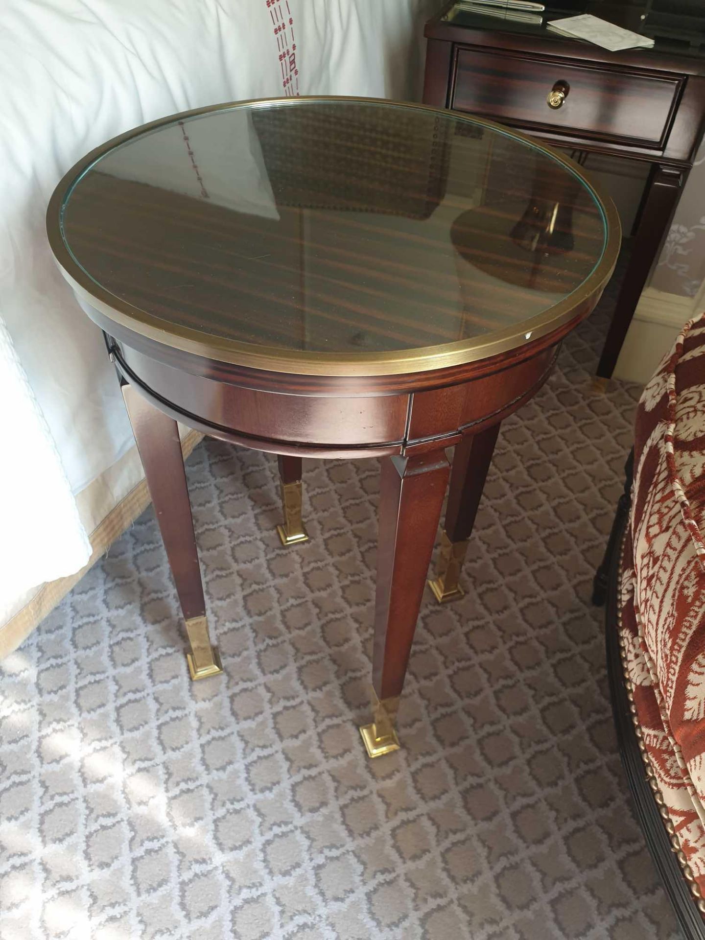 Circular Side Table With Antiqued Plate Top And Brass Trim Mounted On Tapering Legs With Brass