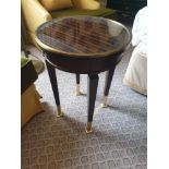 Circular Side Table With Antiqued Plate Top And Brass Trim Mounted On Tapering Legs With Brass