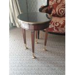 Circular Side Table With Antiqued Plate Top And Brass Trim Mounted On Tapering Legs With Brass