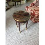 Circular Side Table With Antiqued Plate Top And Brass Trim Mounted On Tapering Legs With Brass