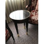 Circular Side Table With Antiqued Plate Top And Brass Trim Mounted On Tapering Legs With Brass