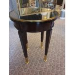 Circular Side Table With Antiqued Plate Top And Brass Trim Mounted On Tapering Legs With Brass