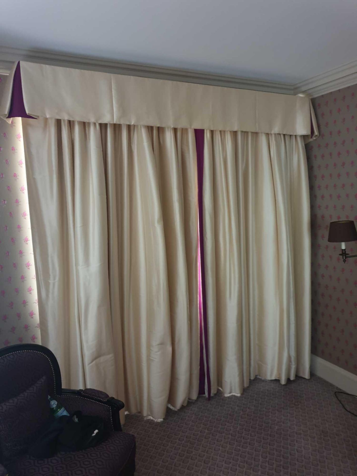 A Pair Of Cream Silk Drapes With Pelmet With Purple Trim Detail On Curtains And Purple Detail In