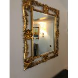 Regency Style Mirror Gilded Bronze Leaf Regency And Rocaille , Decorated With Scrolls, Shells And