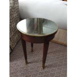 Circular Side Table With Antiqued Plate Top And Brass Trim Mounted On Tapering Legs With Brass