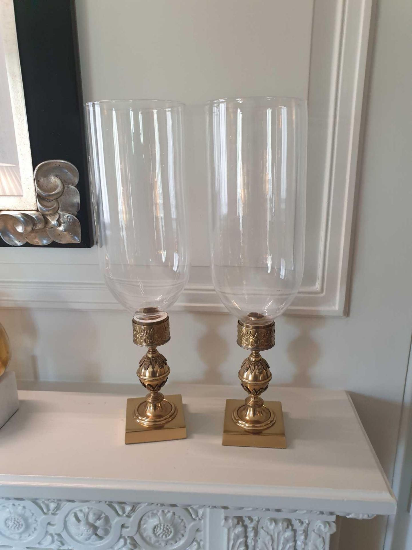 A Pair Of Candle Holders With Tall Glass Shades And Brass Featuring Ornamental Design 42cm (Room 306