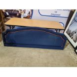 Large blue headboard luxury padded upholstered with red piping, pleated edge (ripped upholster on