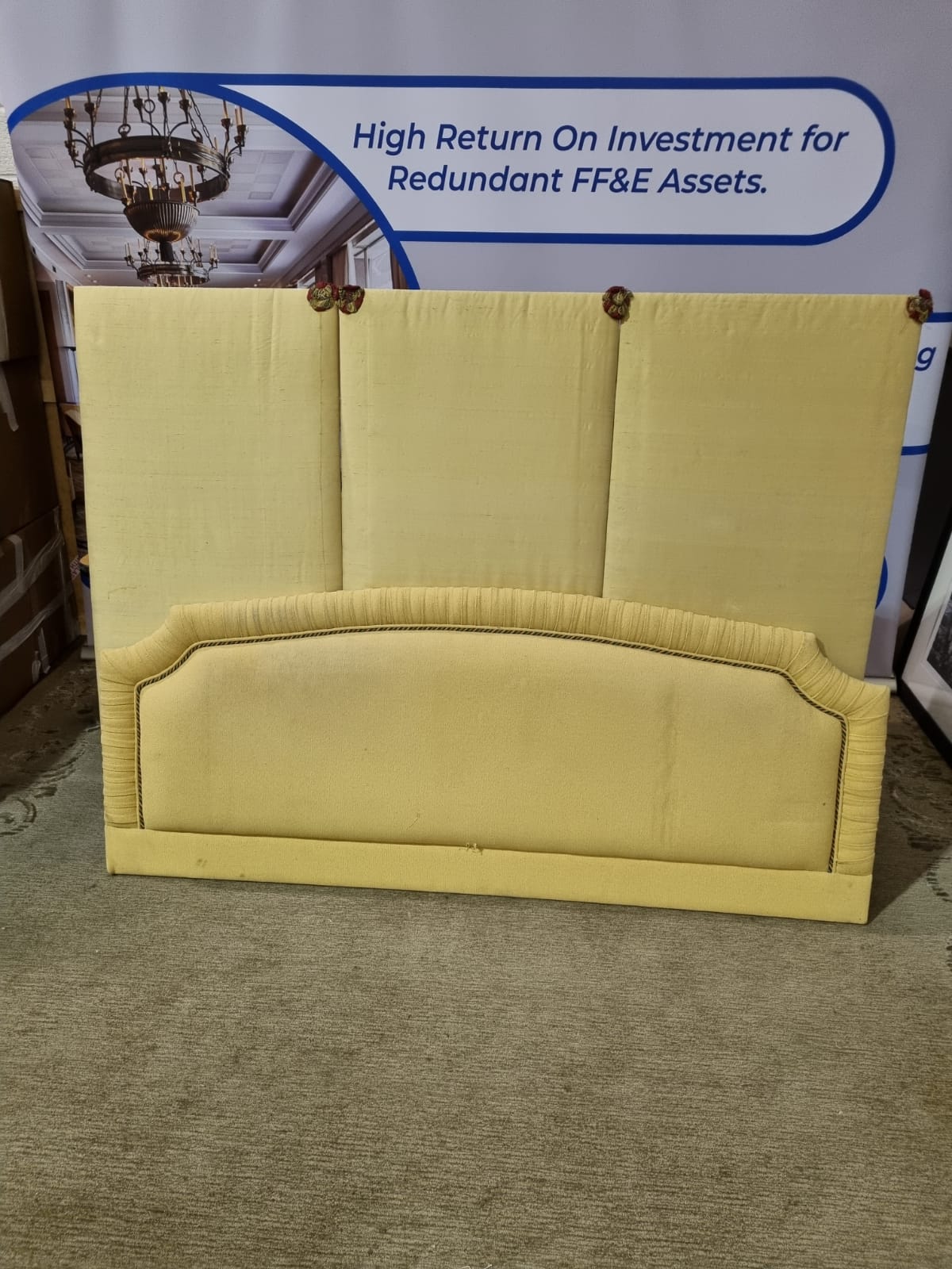 Large yellow headboard luxury padded upholstered with multicoloured piping and pleated top with
