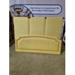 Large yellow headboard luxury padded upholstered with multicoloured piping and pleated top with