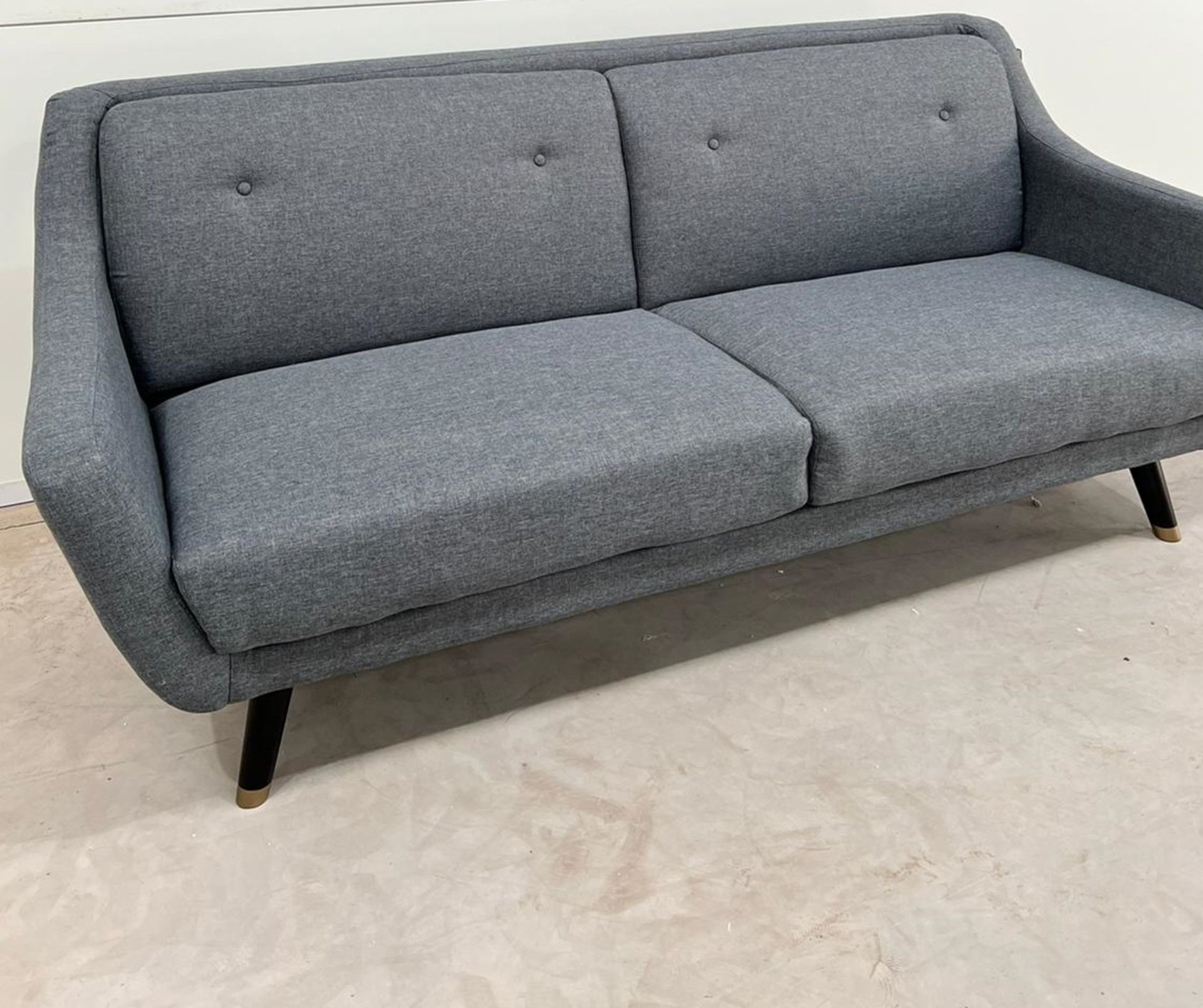 Lance Three Seater Sofa In Grey Linen Legs Finished In Dark Oak With Gold Toned Tips This