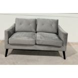 Carla Grey Velvet Two Seater Sofa . With High Back Cushions And Padded Armrests Paired With