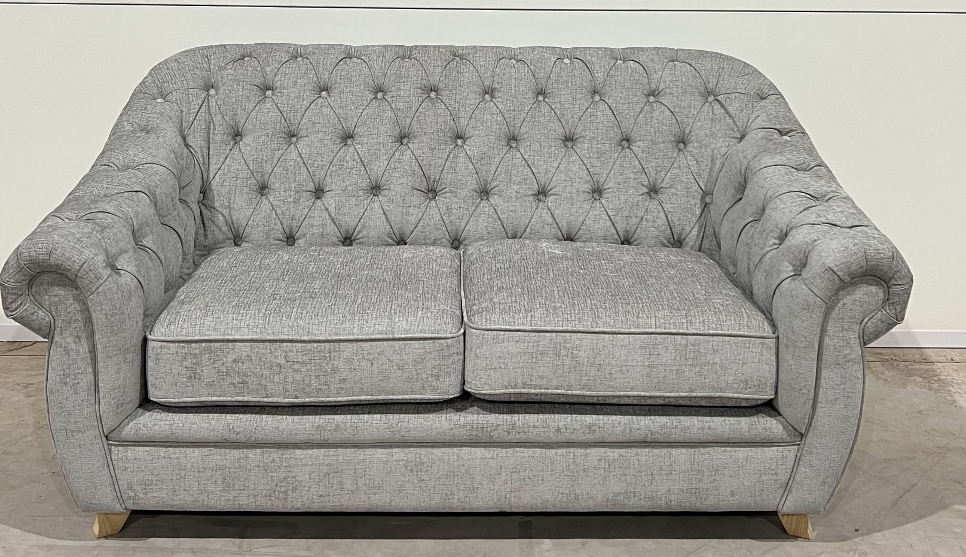 Lilly Chesterfield Grey Plush Fabric Two-Seater Sofa Featuring Deep-Buttoning, Rolled Arms And