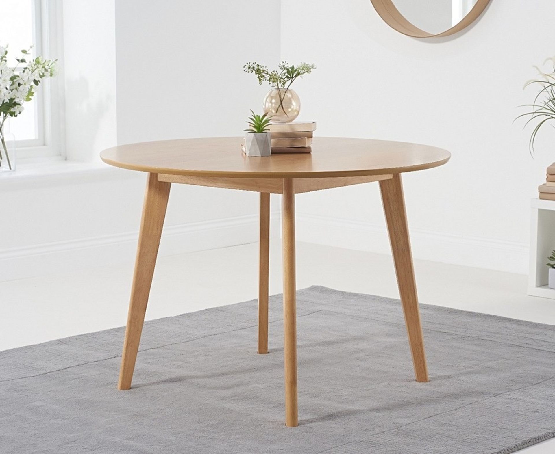 Sacha Oak 110cm Round Dining TableSacha Collection The Sacha collection combines contemporary