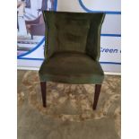 A green velvet contemporary accent chair with gold piping trim 62 x 48 x 85cm