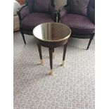 Circular Side Table With Glass Plate Top And Brass Trim Mounted On Tapering Legs With Brass Foot