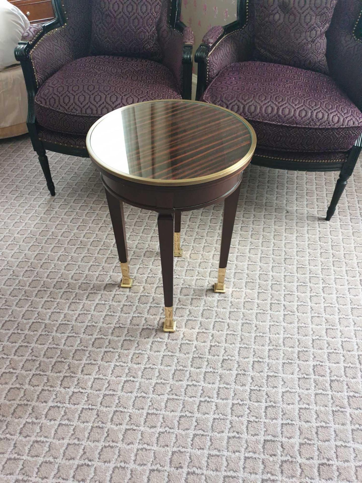 Circular Side Table With Glass Plate Top And Brass Trim Mounted On Tapering Legs With Brass Foot