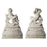 A Pair Of Very Large Putti Or Cherub Statues On Pedestal Columns Fully Cast In Stone In Cream