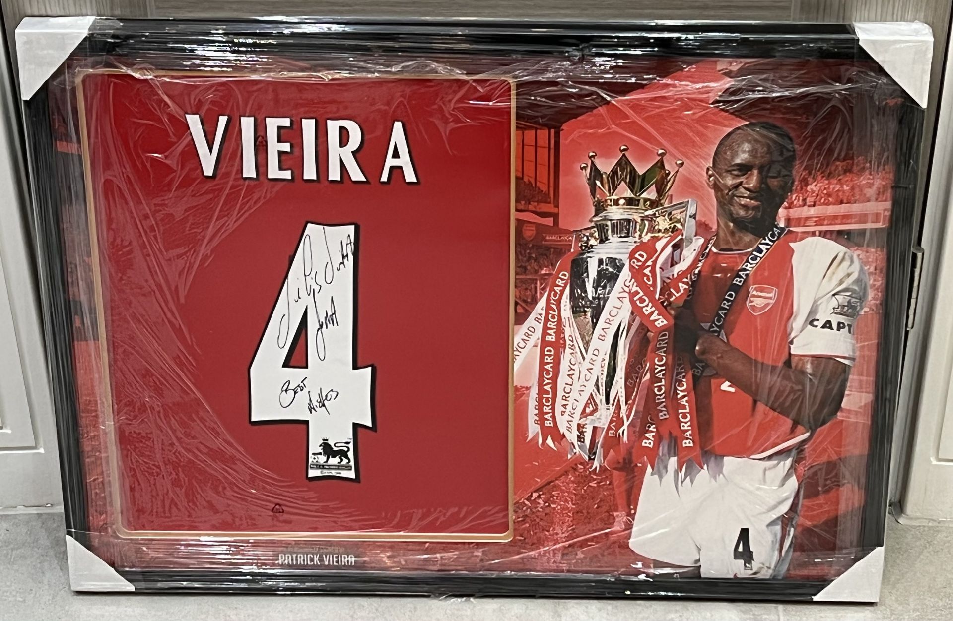 Authentic Arsenal shirt display hand signed by French national football player Patrick Vieira .