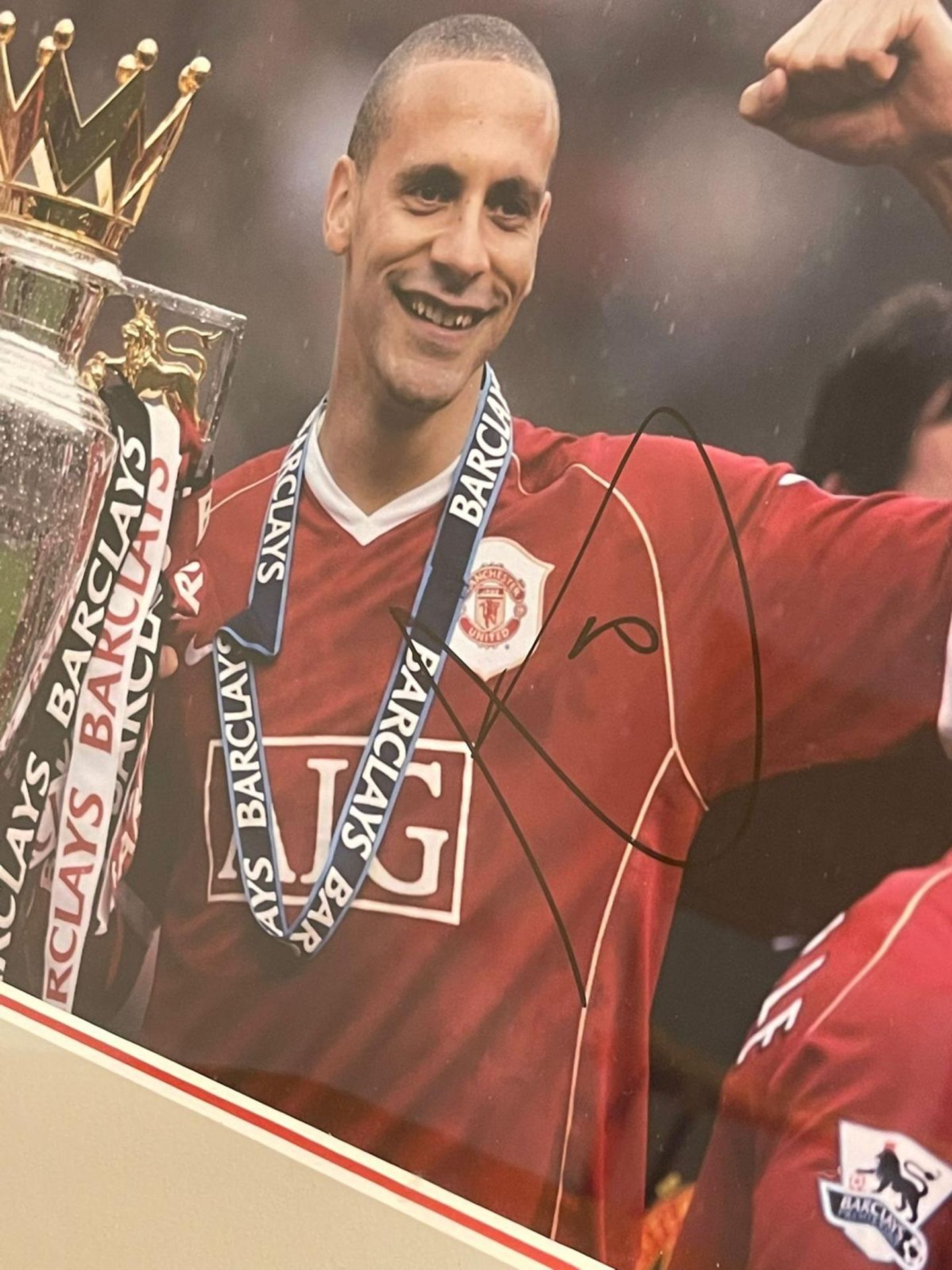 Hand signed Rio Ferdinand photograph featuring him with title winning trophy for Manchester United - Image 4 of 6