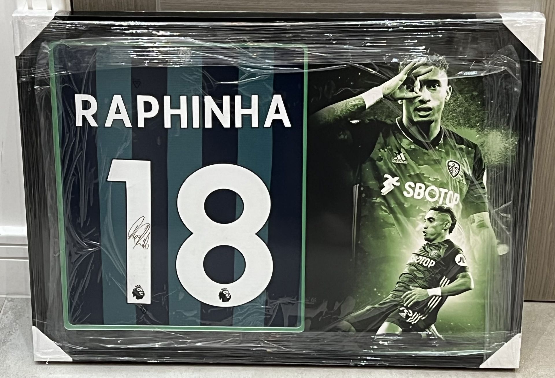 Authentic Leeds United shirt display hand signed by Brazilian football player Raphinha , currently