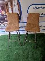 A pair of Palmer Bar Stools A contemporary design with a rustic twist, this stylish vintage brown