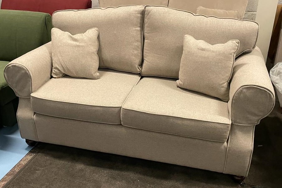 Lyneham 120 sofa in beige The Lyneham design is a classic British piece, with hand-carved scrolled