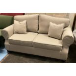 Lyneham 120 sofa in beige The Lyneham design is a classic British piece, with hand-carved scrolled