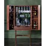 Benwest Cocktail Cabinet- A Capacious And Stylish Cocktail Cabinet Featuring Solid Black American