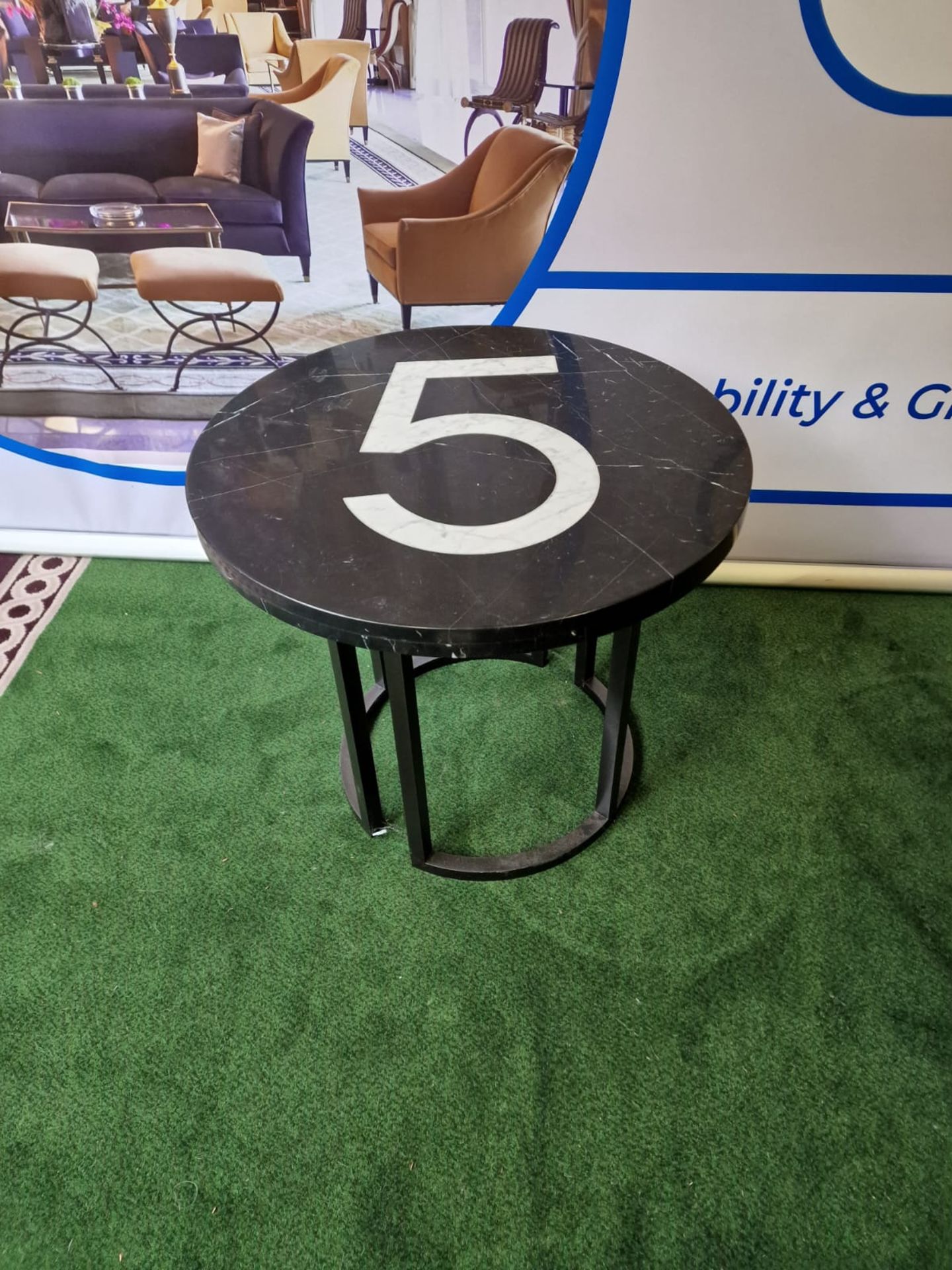 Timothy Oulton Black Marble Topped table with the number 5 centrepiece on a Black Metal Base 70cm