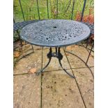 A Metal Painted Circular Garden Table Of Pierced Form Mounted On Three Legs 68 x 63cm