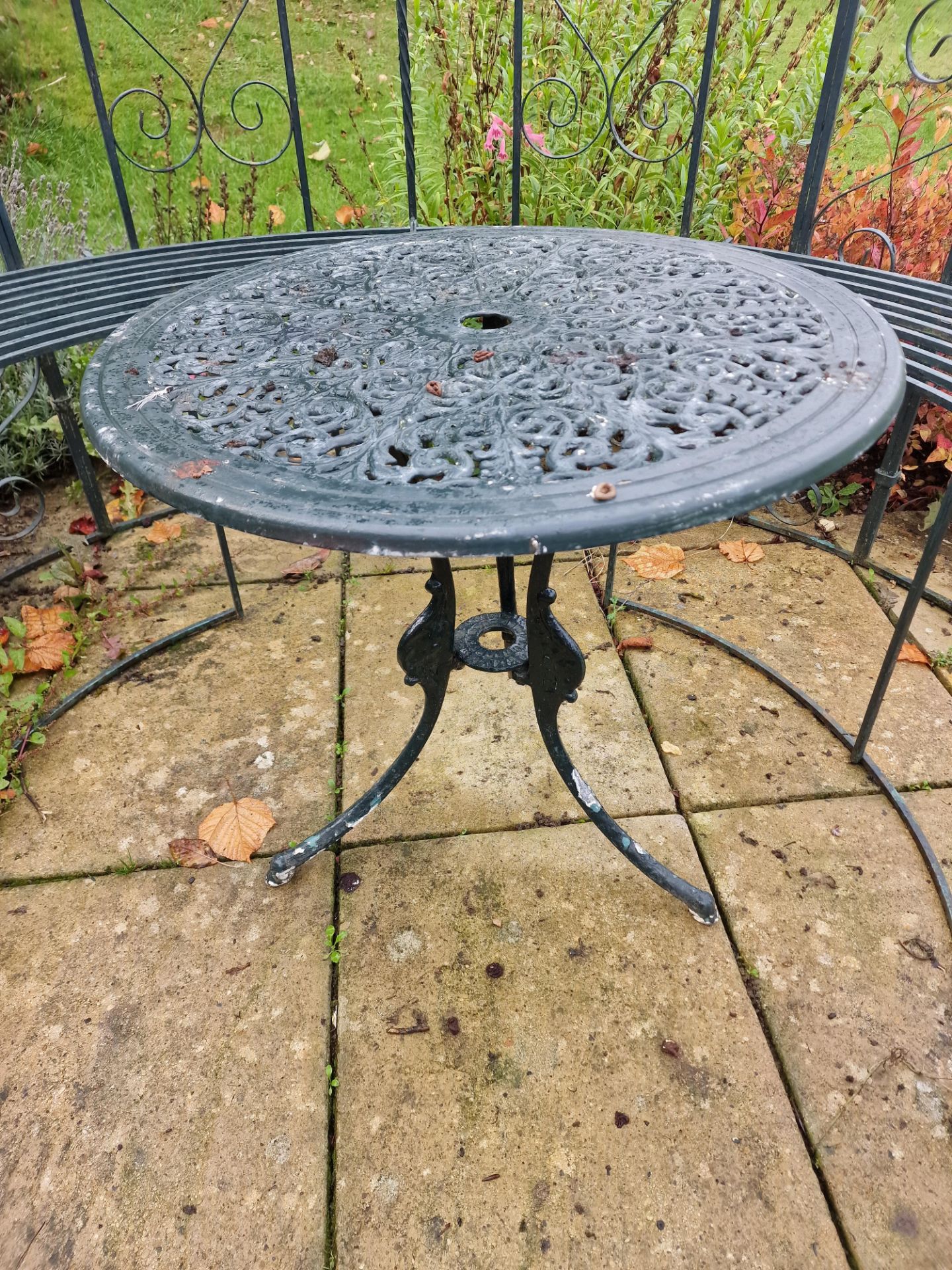 A Metal Painted Circular Garden Table Of Pierced Form Mounted On Three Legs 68 x 63cm